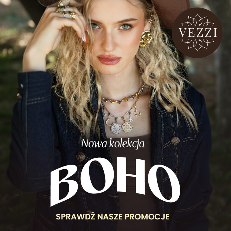 Kobieta w brązowym kapeluszu i ciemnej kurtce jeansowej prezentuje duże złote kolczyki, pierścionki oraz naszyjniki z zawieszkami w kształcie monet i księżyców. Na grafice logo VEZZI i napisy „Nowa kolekcja BOHO” oraz „Sprawdź nasze promocje”.